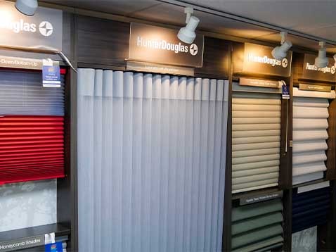 A display of multiple Hunter Douglas window coverings